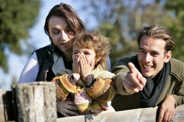 Amazed family witnessing a once in a lifetime experience clipart