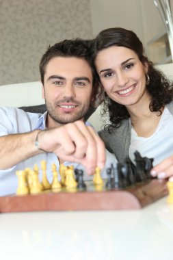 Couple playing chess clipart