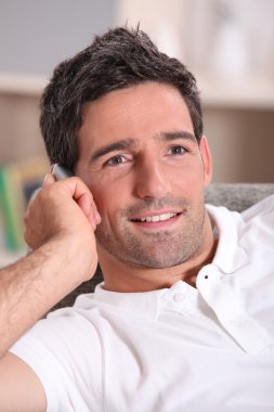 Man at home on a phone call clipart