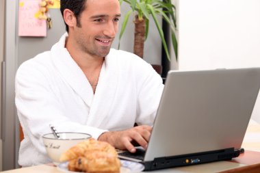 Breakfast in bathrobe with computer clipart