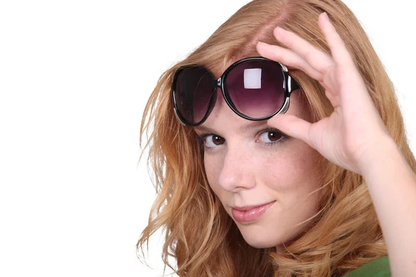 Studio closeup of young beautiful redhead with big sunglasses — Stock Photo, Image