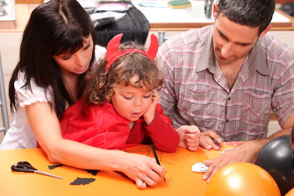 Parents with children dressed as devil — Stock Photo, Image