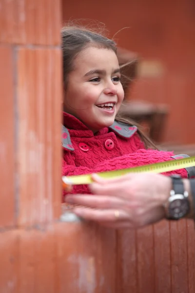 Little girl on a building site — Stock Photo, Image