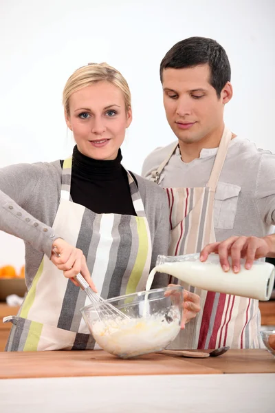 Couple in the kitchen baking — Stock Photo, Image