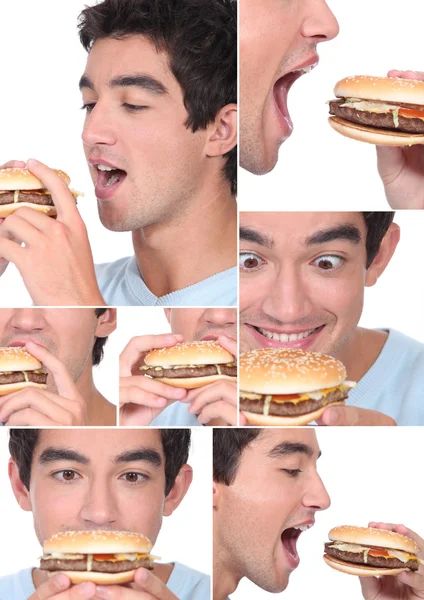 Ung man äta en hamburgare — Stockfoto