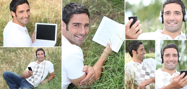 男子听音乐户外活动通过笔记本电脑 — 图库照片