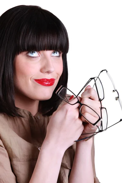 Vrouw met vele paren van bril — Stockfoto