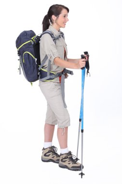 A hiker with her gear clipart