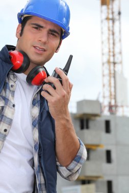 Foreman with radio on site clipart