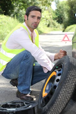 Man with a puncture clipart