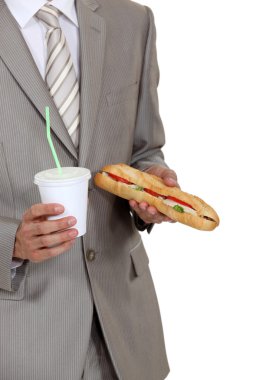 Businessman holding sandwich and soft drink clipart