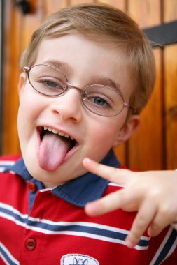 Young boy making a silly face clipart