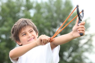 Boy with slingshot clipart
