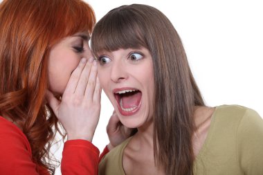 Women sharing a shocking secret clipart