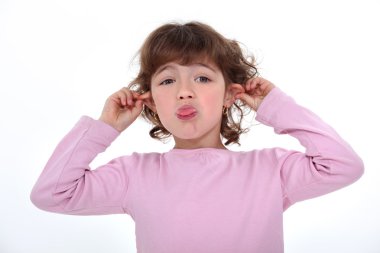 Little girl pulling funny face clipart