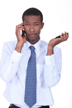 Businessman with cellphones clipart