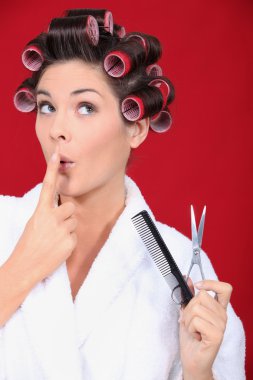 Woman in bath robe wearing hair rollers clipart