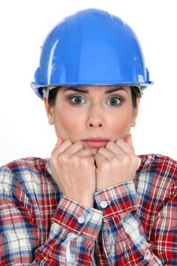 Scared female construction worker clipart