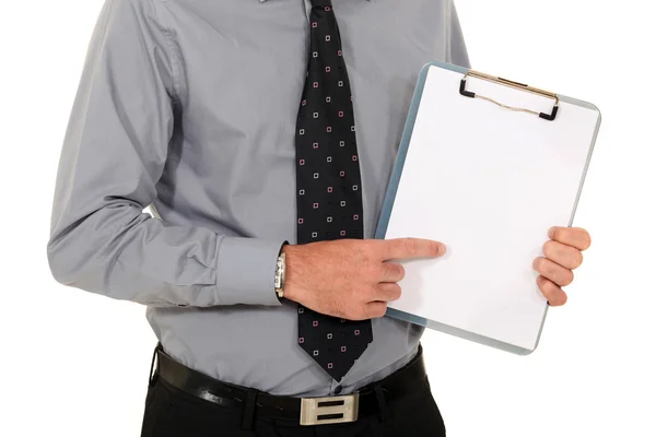 Man pointing at blank clip-board — Stock Photo, Image