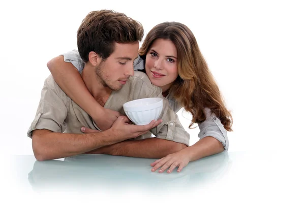 Couple with empty bowl — Stock Photo, Image