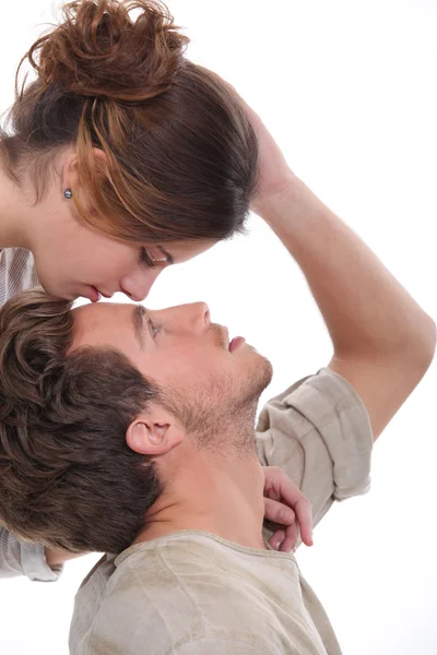Woman kissing man on the forehead — Stock Photo, Image