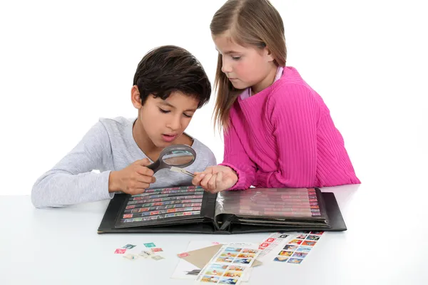 Children stamp collecting — Stock Photo, Image