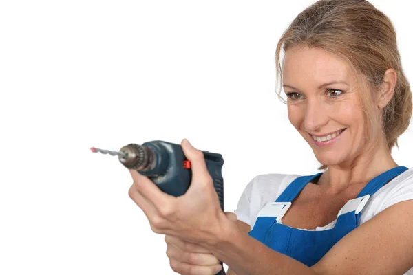 Woman holding drill — Stock Photo, Image