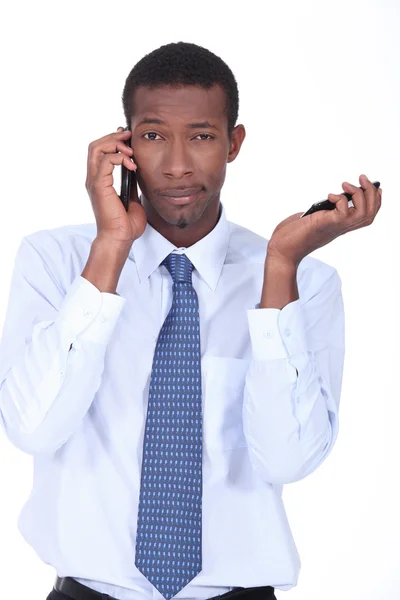 Businessman with cellphones — Stock Photo, Image