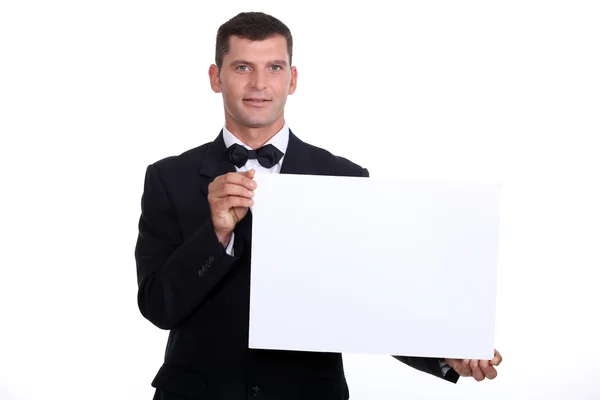 Waitor holding a blank menu — Stock Photo, Image