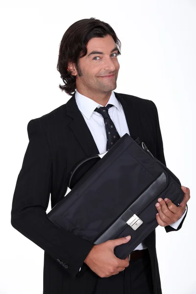 Happy executive holding case — Stock Photo, Image