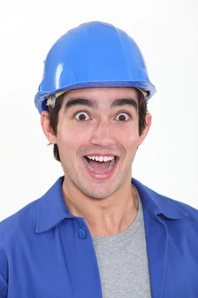 Portrait of young tradesman playing the fool — Stock Photo, Image