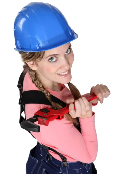 Blond trainee posing with wrench — Stock Photo, Image
