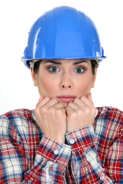Scared female construction worker — Stock Photo, Image
