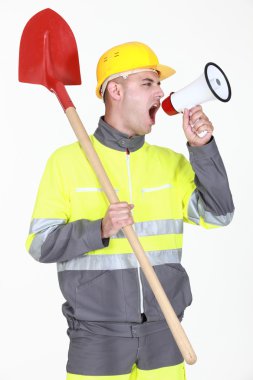 Construction with shovel shouting into megaphone clipart