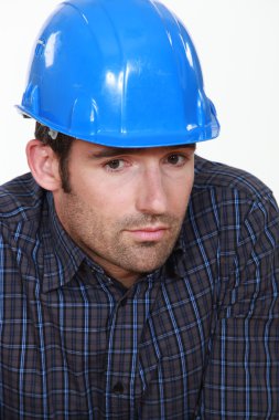 Portrait of tradesman lacking self-confidence clipart