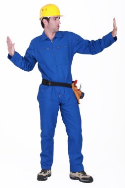 Tradesman pushing invisible walls clipart