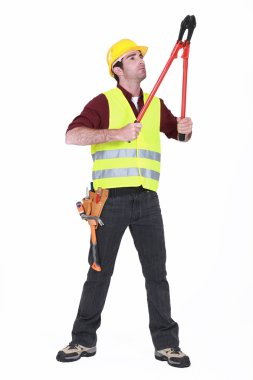 Worker using bolt cutters clipart