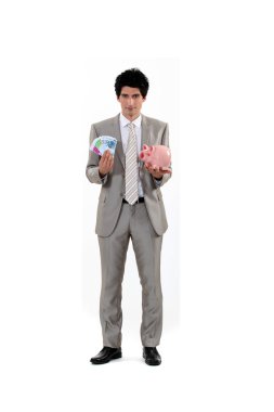 Man saving his money in a piggy bank clipart