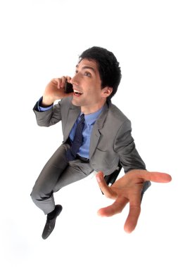 Peppy businessman talking on his mobile phone clipart