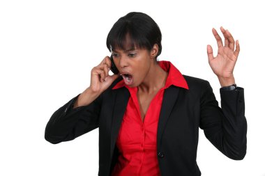 Businesswoman shouting down the phone clipart