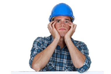 Head and shoulders of a young construction worker clipart