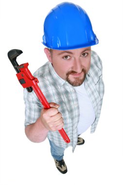 Builder with an adjustable wrench clipart