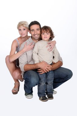 Two parents and their 5 years old son clipart