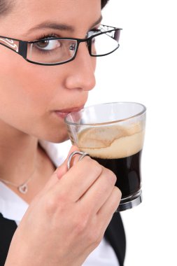 Woman having a coffee clipart