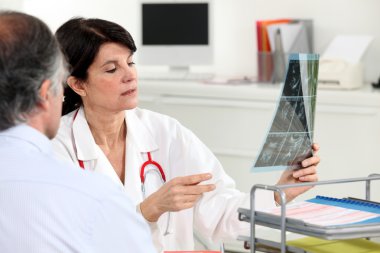 Patient receiving x-ray results clipart