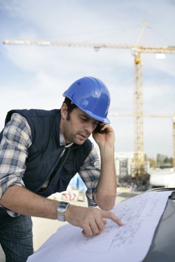 Foreman checking plan clipart