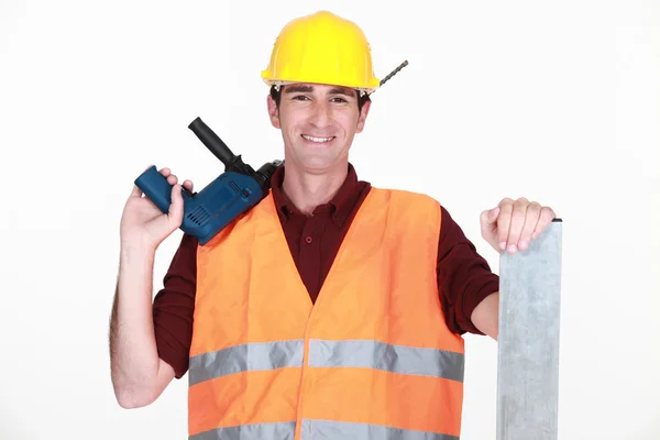 Arbetstagare med en stor borr — Stockfoto