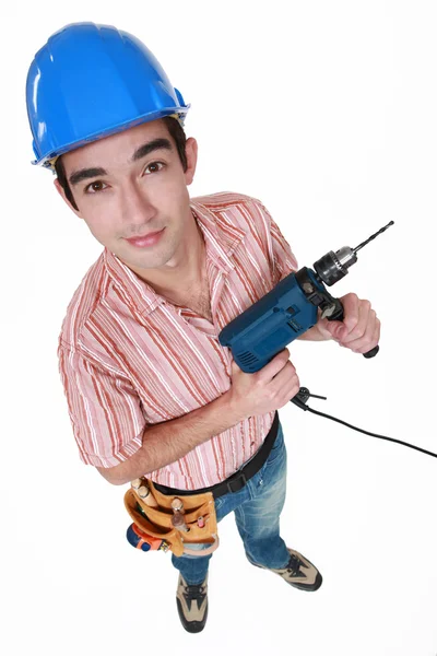 Jonge man met een boormachine — Stockfoto