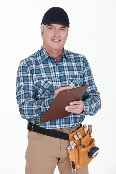 Carpenter with clipboard — Stock Photo, Image