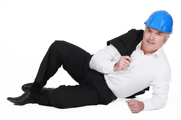 Engineer lying on the ground — Stock Photo, Image